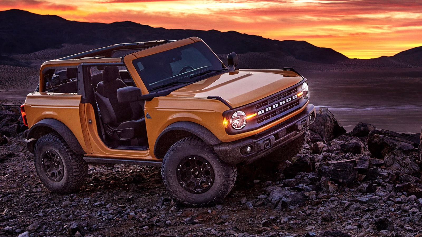 Ford Bronco climbing over rocks